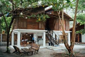 a building with a library with a person sitting at a table at Alun Hostel in San Felipe