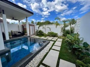 a swimming pool in the backyard of a house at Brio de Agoho in Candelaria
