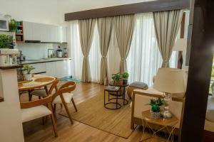 a kitchen and living room with a table and chairs at Brio de Agoho in Candelaria