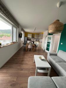 a living room with a couch and a table at Green view 180 in Troyan