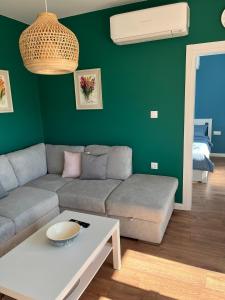 a living room with a couch and a table at Green view 180 in Troyan