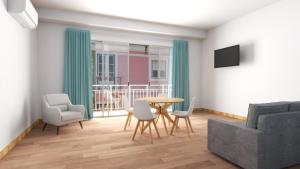 a living room with a table and chairs at Climia 2Sleep Apartments in Benidorm