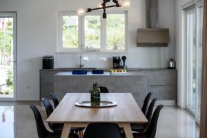 a table in a kitchen with a bottle on it at Villa Soderini in Dubrovnik