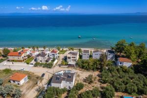 an aerial view of a beach with houses and the ocean at LUKA VILLAS Plage in Polychrono