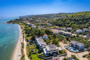 an aerial view of a resort on a beach at LUKA VILLAS Plage in Polychrono