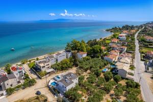 an aerial view of a city and the ocean at LUKA VILLAS Plage in Polychrono