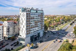 an aerial view of a building with a clock tower at Sheraton Novi Sad in Novi Sad