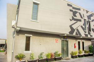 a building with a painting on the side of it at KLSApartment in Lagos