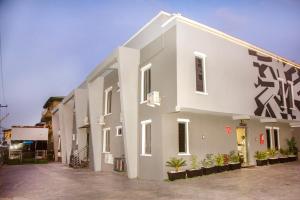 a white building with graffiti on the side of it at KLSApartment in Lagos