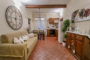 a living room with a couch and a dining room at Florence Tower Apartment in Florence