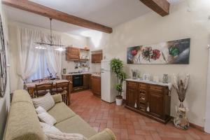 a living room with a couch and a kitchen at Florence Tower Apartment in Florence +15 photos