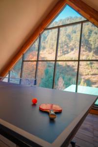 a table in front of a large window at Semari Resort in Muzaffarabad