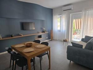 a living room with a table and a couch at Sole e Sale in Terracina +18 photos