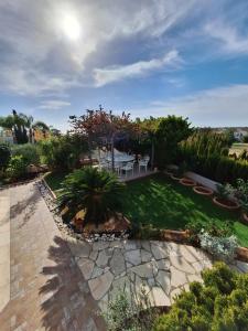 an aerial view of a garden with a patio at ROSE VILLA - 3 BED POOL in Episkopi Limassol