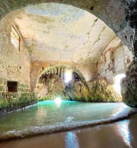 a tunnel over a river under a bridge at DIADEMA Luxury Suite in Nardò