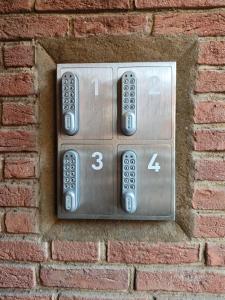 a remote control installation on a brick wall at Hotel Zum Roten Tore in Lüneburg