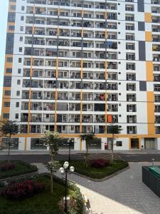 a large apartment building with many balconies at Mochi Home in An Dương