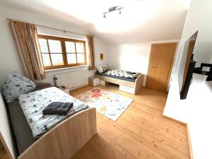 an overhead view of a bedroom with two beds at Ferienwohnung Leitacker im Kaiserwinkl in Rettenschöss +9 photos