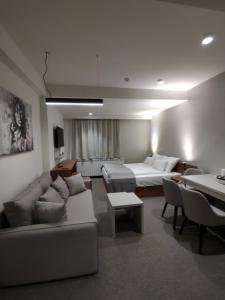 a living room with a couch and a table at Star Hill - Koznik Konaci in Kopaonik