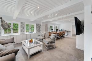 a living room with a couch and a table at Carolinen Hof 1 in Tinnum