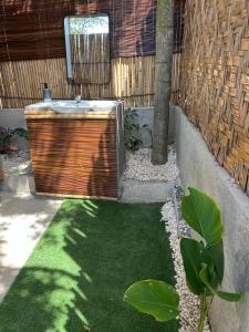 a bathroom with a sink in a yard at Vista Cadlao in El Nido +15 photos
