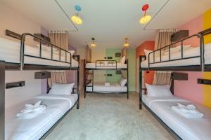 a room with three bunk beds in a hostel at HOST'S EL Fisherman in Nathon Bay +42 photos