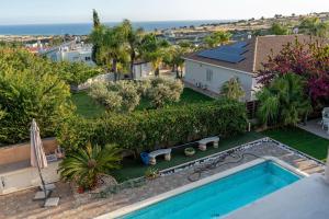 an aerial view of a house with a swimming pool at ROSE VILLA - 3 BED POOL in Episkopi Limassol