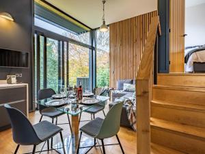 a dining room with a glass table and chairs at 2 Bed in Brecon oc-59734 in Talgarth