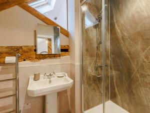 a bathroom with a sink and a shower at 3 Bed in Whitchurch oc-88915 in Whixall +21 photos