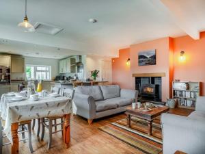 a living room with a couch and a table at 2 Bed in Llangammarch Wells oc-bn059 in Garth