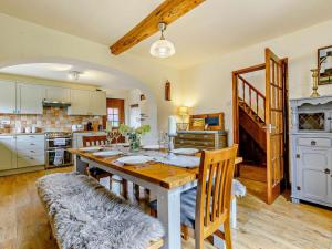 a kitchen with a table and chairs in a room at 4 Bed in Hereford oc-44213 in Hereford
