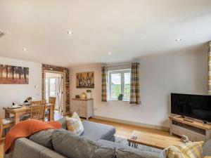a living room with a couch and a tv at 2 Bed in Newark oc-87683 in Coddington
