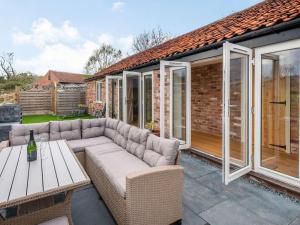 a patio with a couch and a table at 2 Bed in Newark oc-87683 in Coddington