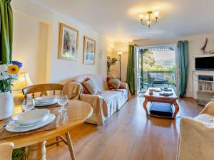 a living room with a couch and a table at 1 Bed in Abergavenny oc-52882 in Gilwern