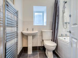 a bathroom with a toilet and a sink at 3 Bed in Buxton oc-77955 in Tideswell