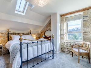 a bedroom with a bed and a window at 2 Bed in Matlock oc-83435 in Bonsall