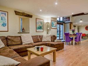 a living room with a couch and a table at 2 Bed in Coleford oc-78181 in Symonds Yat