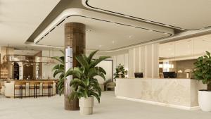 a lobby with a reception desk and a plant at Hotel Atrium in Split +54 photos