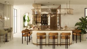 a kitchen with a bar with stools at Hotel Atrium in Split