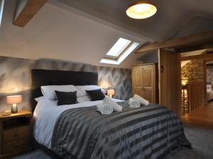 a bedroom with a large bed with towels on it at 2 Bed in Bath oc-47045 in Farmborough