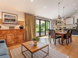 a kitchen and living room with a table and chairs at 2 Bed in Hereford oc-82095 in Byford +30 photos