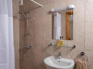 a bathroom with a sink and a shower with a mirror at 4 Bed in Brecon oc-bn151 in Devynock +24 photos