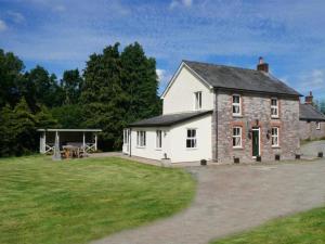 a large white house with a large yard at 4 Bed in Brecon oc-bn151 in Devynock