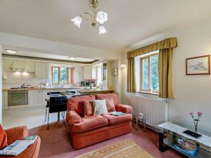 a living room with a couch and a kitchen at 2 Bed in Dronfield oc-pk612 in Barlow