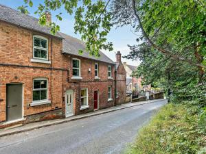 an empty street in front of brick houses at 2 Bed in Ashbourne oc-85571 in Ashbourne