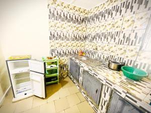 a kitchen with a sink and a counter top at Residence Man zele in Man