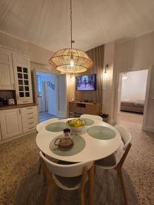 a kitchen with a table with a bowl of fruit on it at Casa Larissa in Rufina