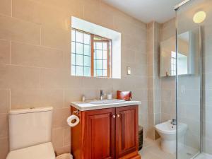 a bathroom with a toilet and a sink and a shower at 5 Bed in Cheltenham oc-94643 in Lower Slaughter +23 photos
