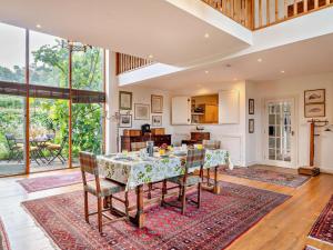 a kitchen and dining room with a table and chairs at 2 Bed in Kington oc-92986 in Lyonshall