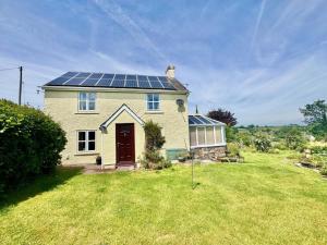 a house with solar panels on the roof at 3 Bed in Brecon oc-93947 in Llanywern